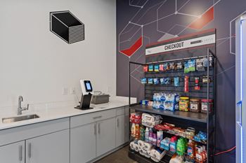 A modern kitchen with a check out counter.